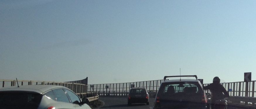 A motorcyclist hitches a ride