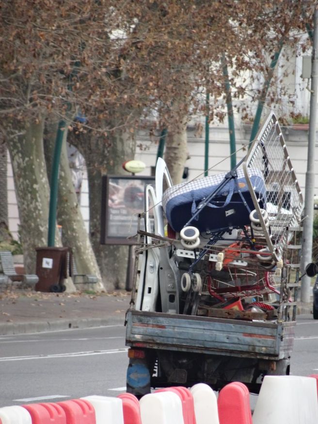 A laoded, three-wheel truck in Naples