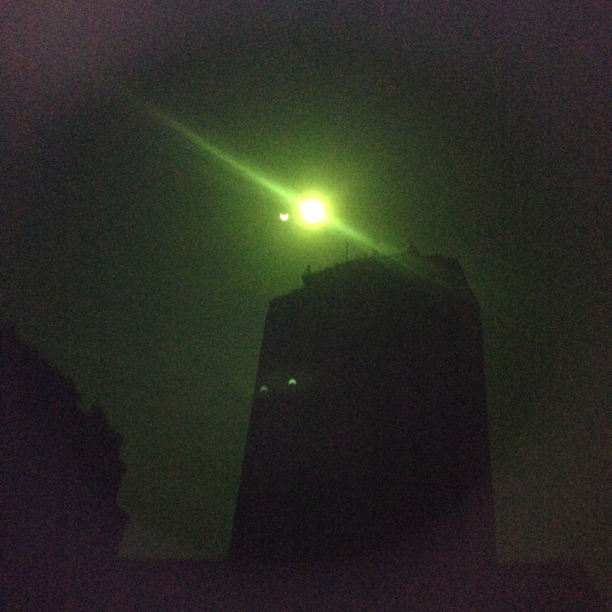 The solar eclipse through dark glass in Naples