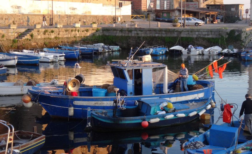 Fishing boat in the old harbour of Pozzuoli