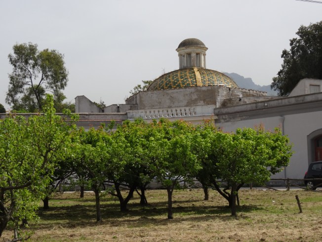 An orchard now fills the small courtyard across from the chapel in Portici, Naples