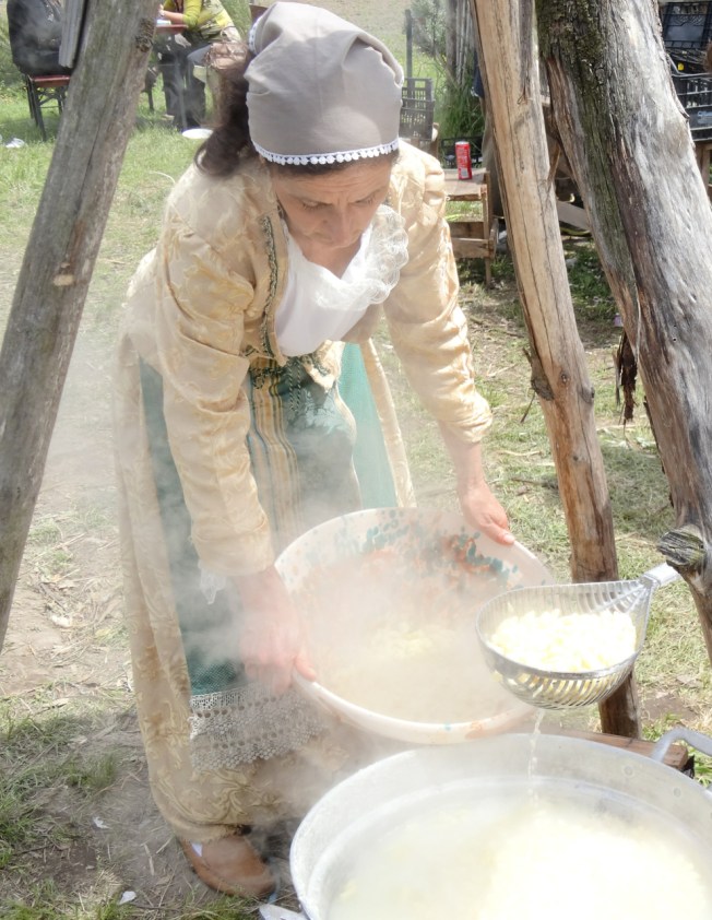 Chefs at their steaming pots over the open fires