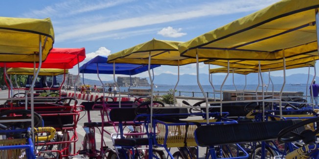 Summer view along the lungomare by the Villa Comunale towards Castel Dell'Ovo