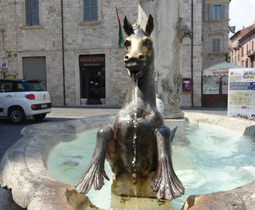 The well-rubbed bronze muzzles of the 'merhorse' fountains