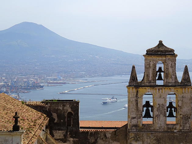 Photograph by Eliza Fraser-Mackenzie: view from Castel Sant'Elmo across the Bay of Naples to Vesuvius with the bells of the 'certoso di San Martino' in the foreground.