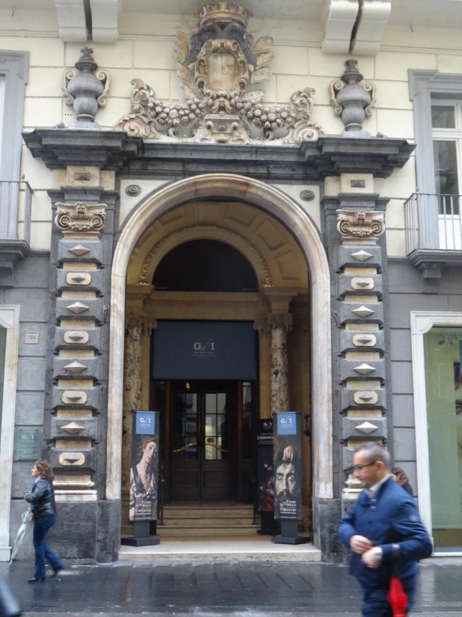 The entrance to the Palazzo Zevallos Stigliano on the Via Toledo in Naples, Italy - home to the painting thought to be Caravaggio's last masterpiece