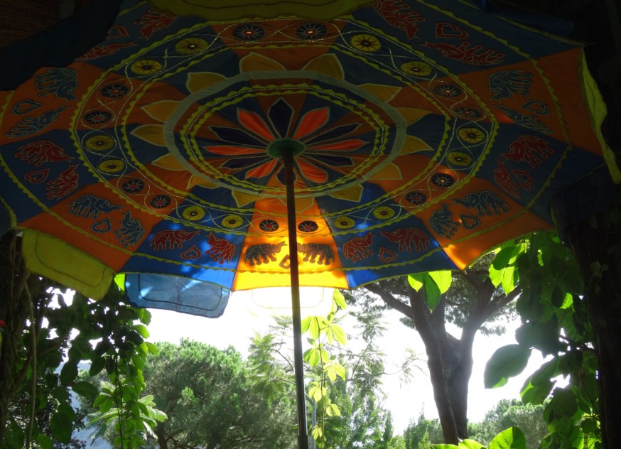 The tea garden at La Mortella - its thatched roof lined with bright umbrellas