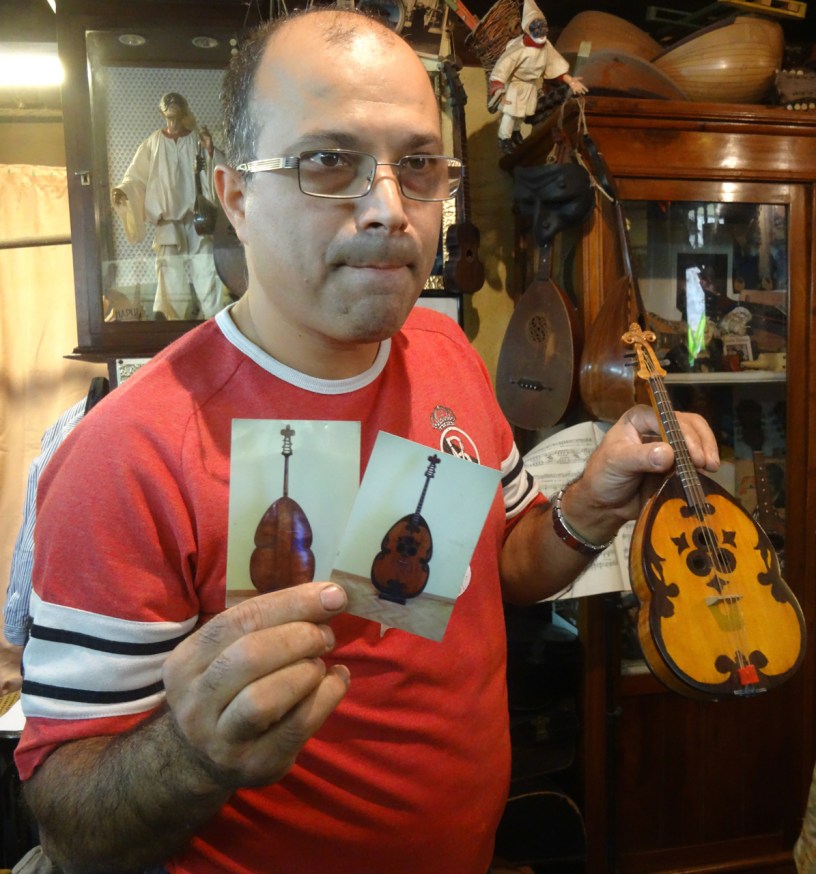 Luthier Salvatore Masiello with tiny replicas of the stringed instruments that have meant so much to Naples and the mandolin