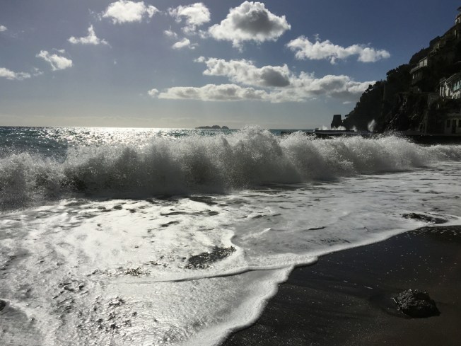 View to a Saracen Tower from a beach in Positano, on the Amalfi Coast in Italy