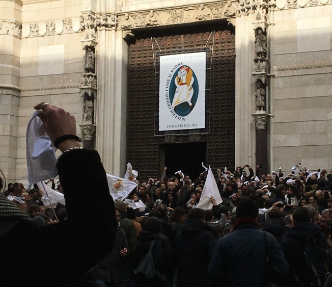 White handkerchiefs wave at the March demonstration on the steps of the Duomo in Naples, Italy