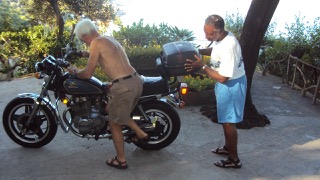 Michael Rae and his Honda motorbike in Naples, Italy