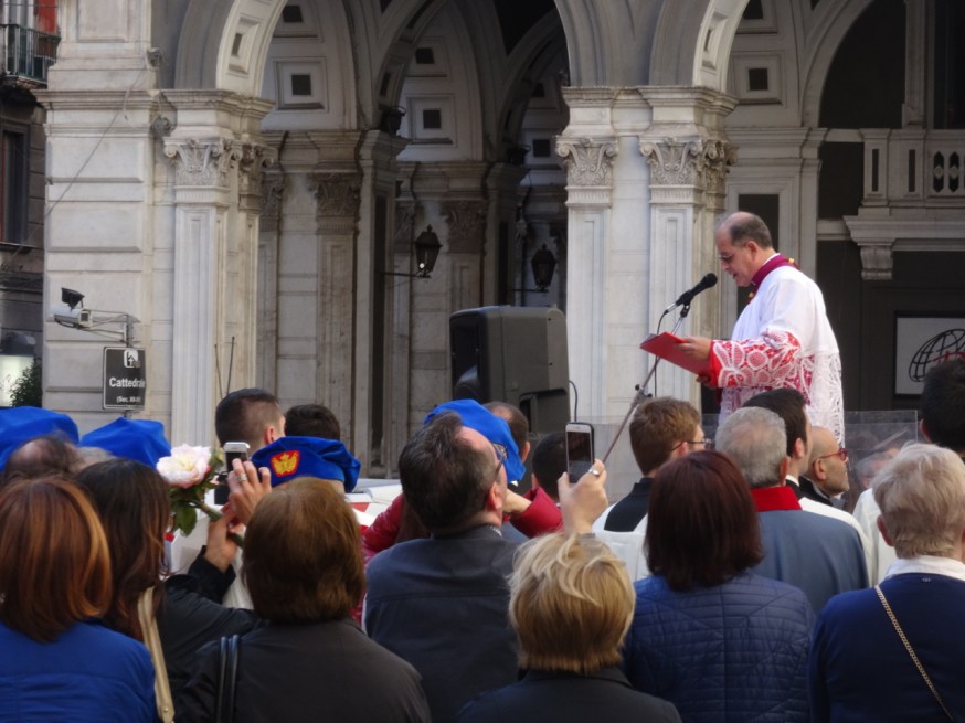 Each saint is introduced in turn outside the Duomo in Naples, Italy