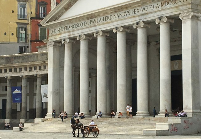 Parade of carriages in the Piazza del Plebiscito in Naples, Italy
