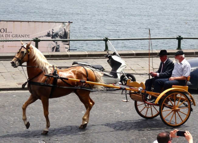 Moving out along the seafront in Naples, Italy