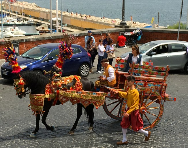 Moving out along the seafront in Naples, Italy