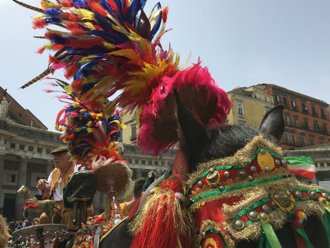 Colour from Sicily in the parade of carriages in Naples, Italy