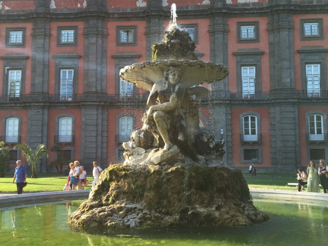 The freshly cleaned fountain at the many-windowed art museum of Capodimonte in Naples, Italy