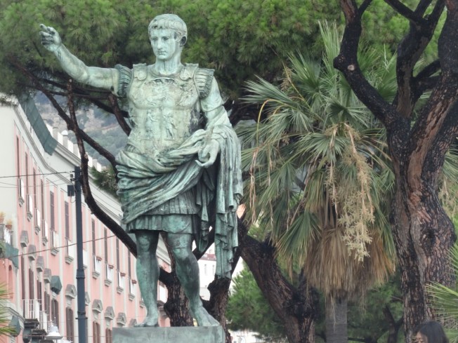 Statue of Caesar on the seafront in Naples Italy