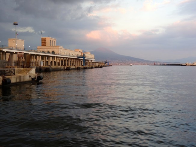 Evening arrival back at the Molo Beverello in Naples, Italy