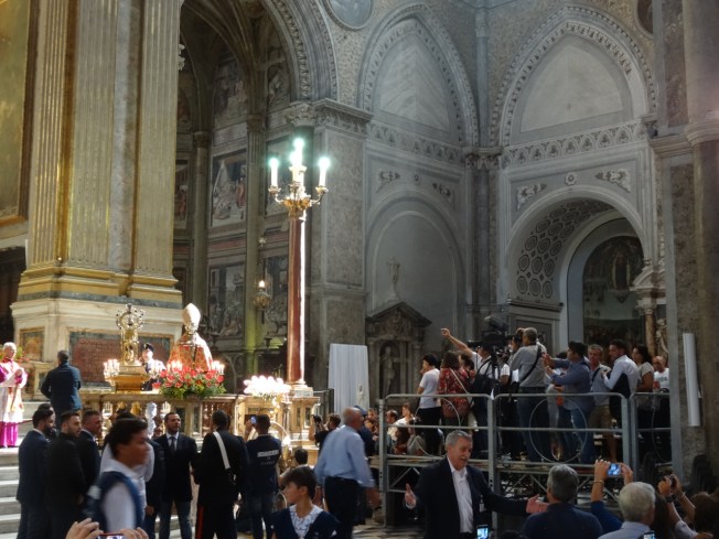 The camera crews inside the cathedral in Naples, Italy on 19 September 2016