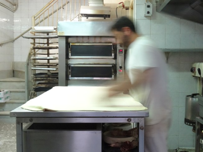A baker at work in Naples, Italy