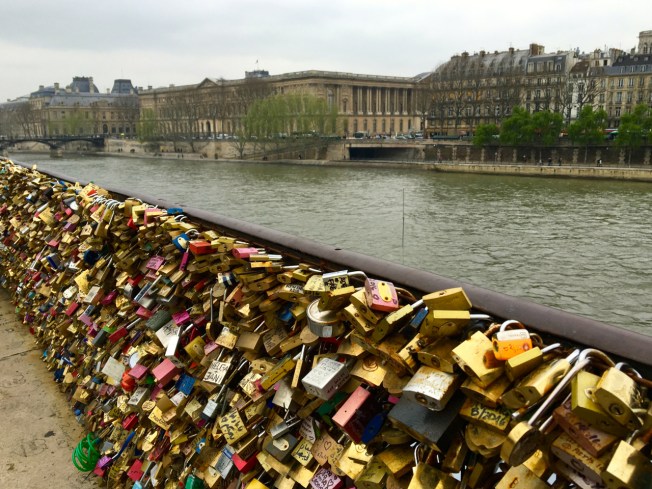Love locks on a bridge over the Seine in Paris, France