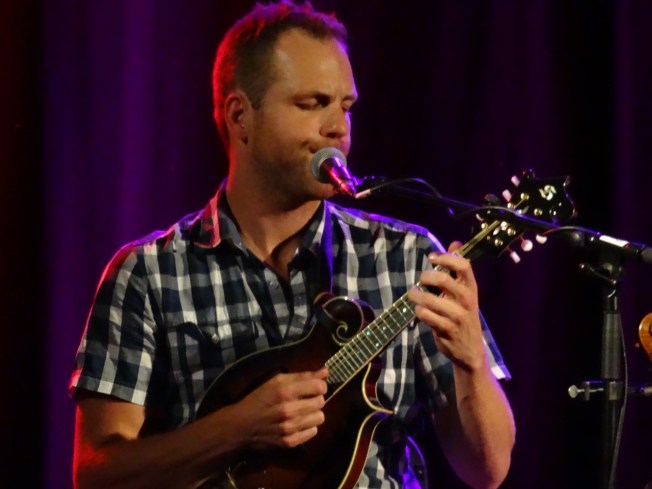 Tommy Gauthier of the Yves Lambert Trio on stage at Sidmouth Folk Week 2017