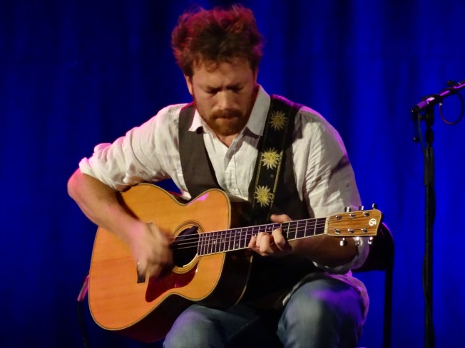 Olivier Rondeau of the Yves Lambert Trio on stage at Folk Week 2017 in Sidmouth, Devon