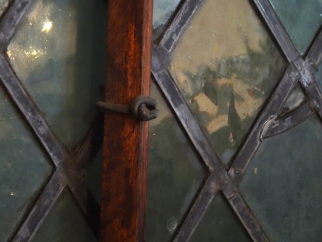 Detail from an original Tudor window in Gloucester, England